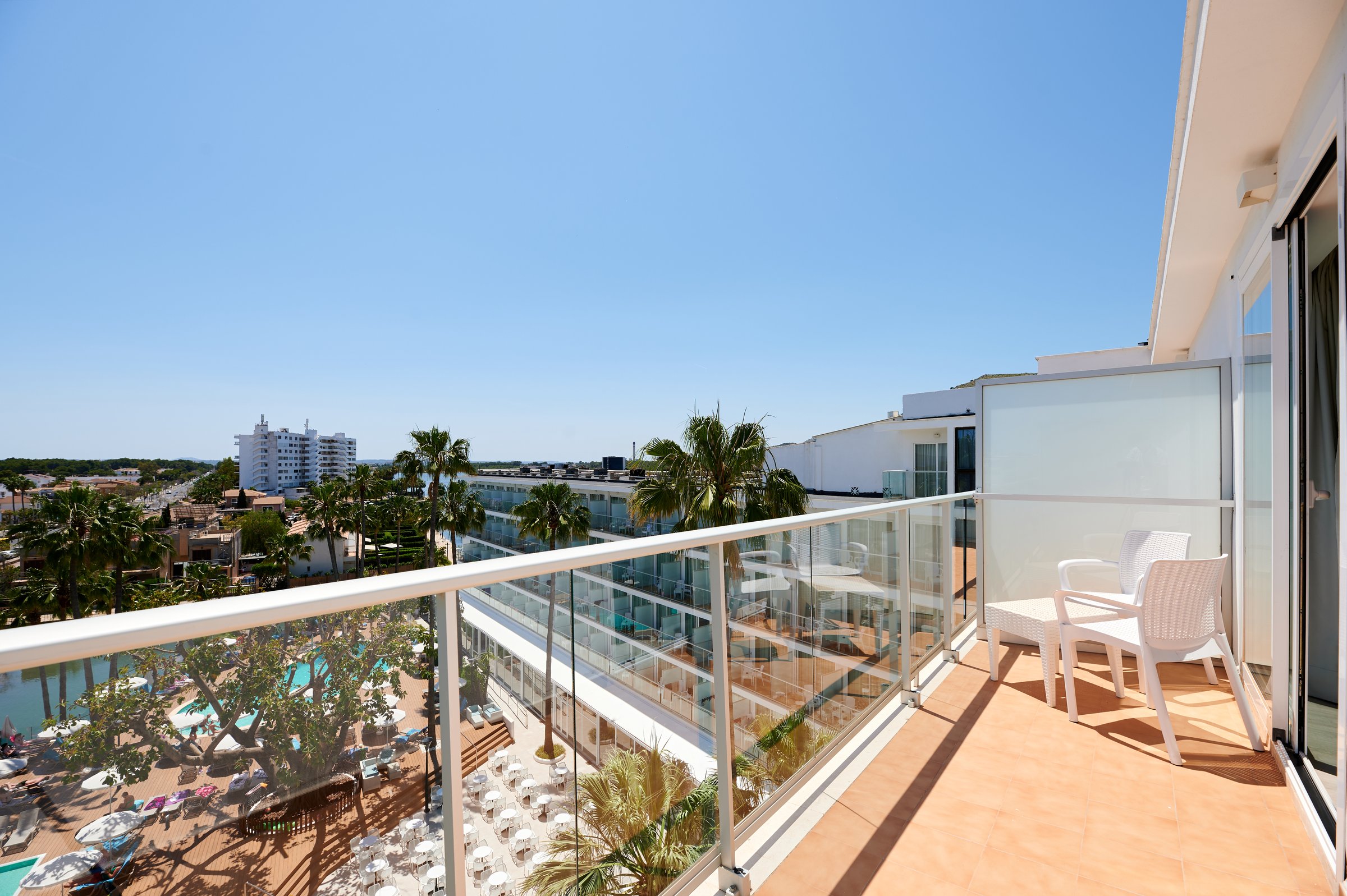 Balcony view over pool, terrace and courtyard