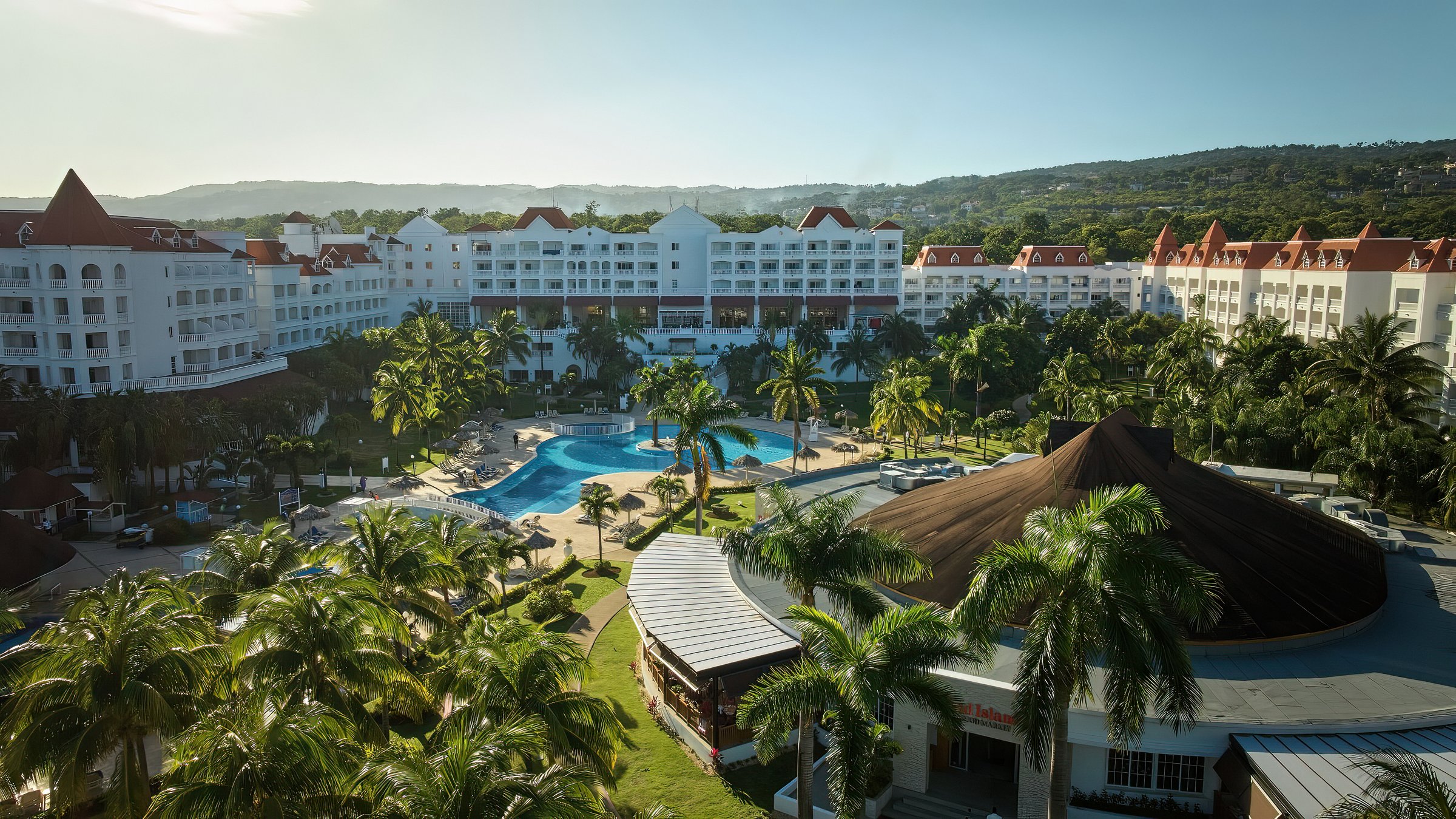 Aerial view of the pool, guest buildings and hills