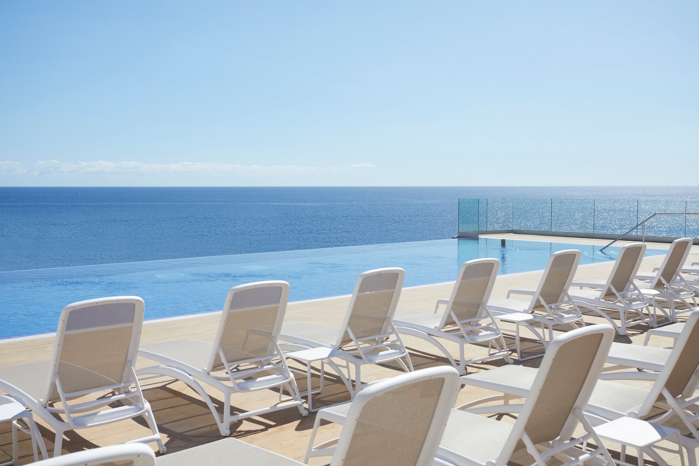 Infinity pool merging with the ocean