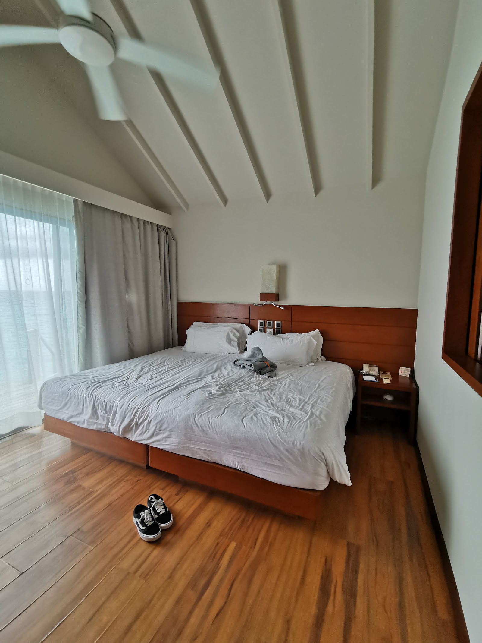 Twin beds decorated with red flowers and birthday messages at Centara Ras Fushi Resort & Spa Maldives.