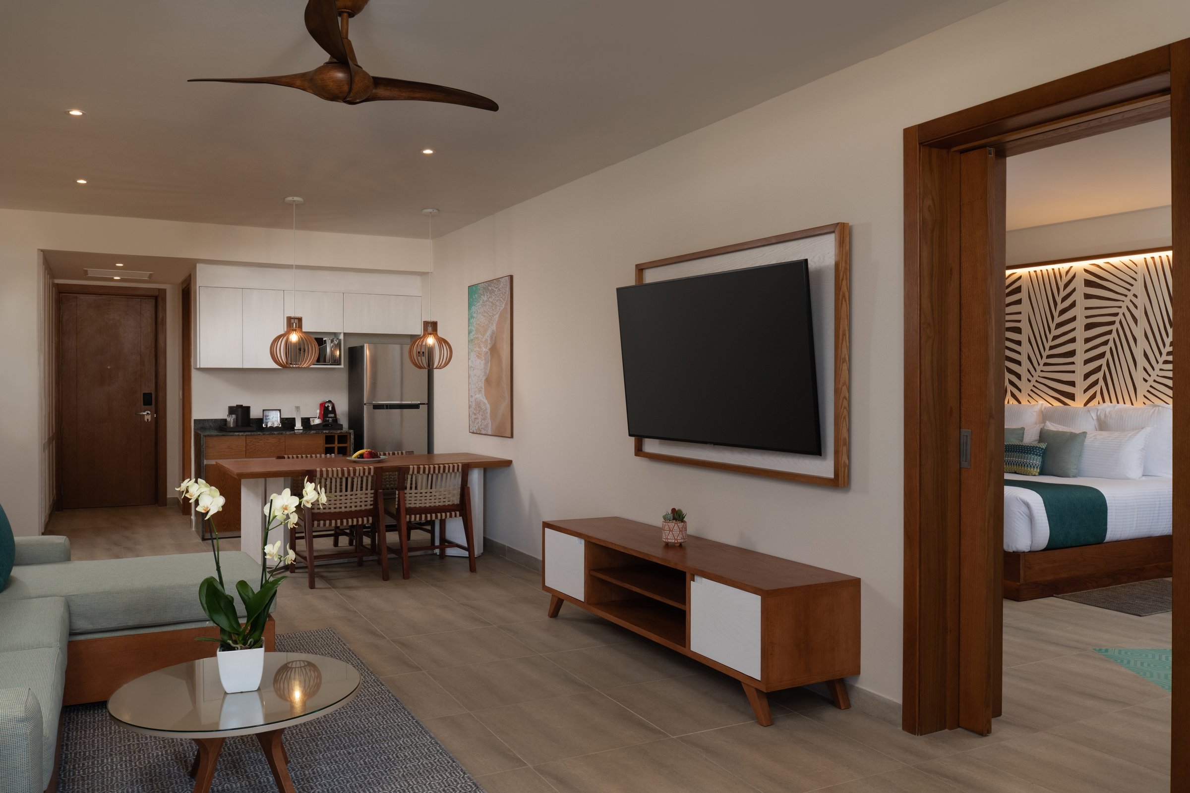 Master suite living room, kitchenette and king bedroom.