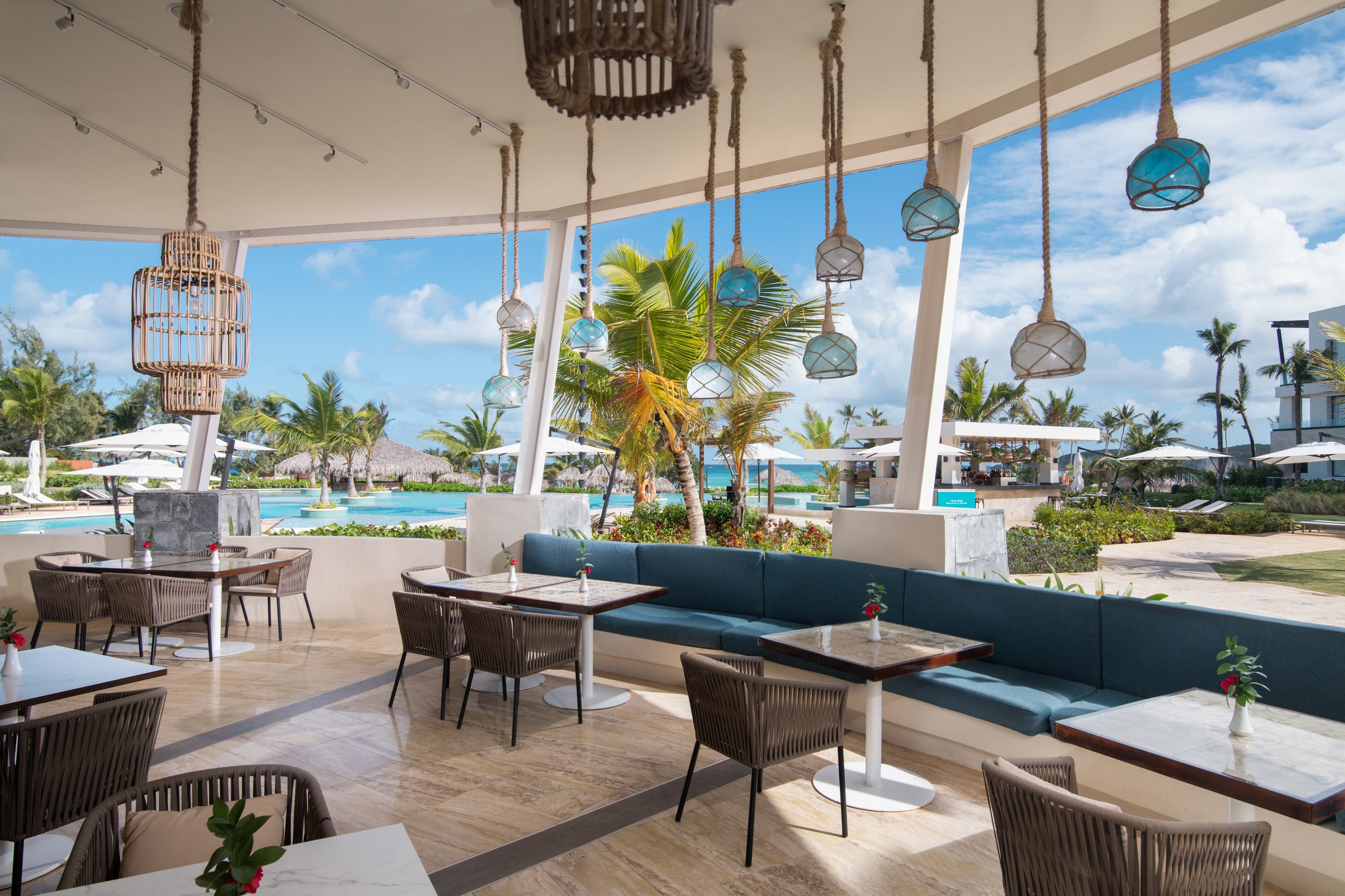 Oceana open-air dining area looking over the pool toward the ocean.