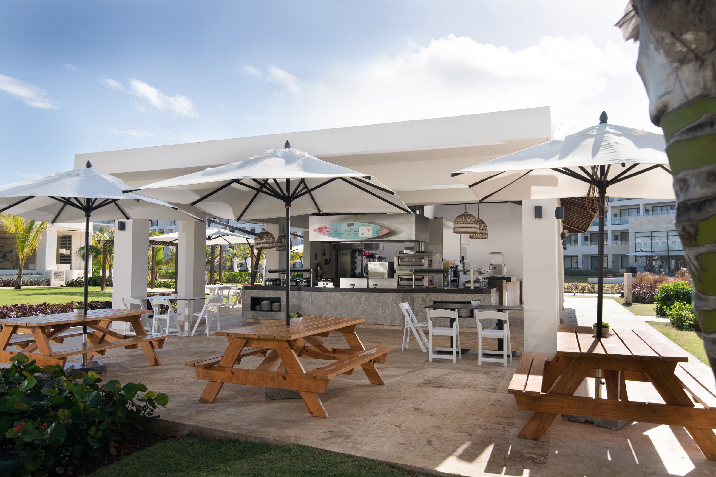 Barefoot Grill open-air pavilion with picnic tables and umbrellas.