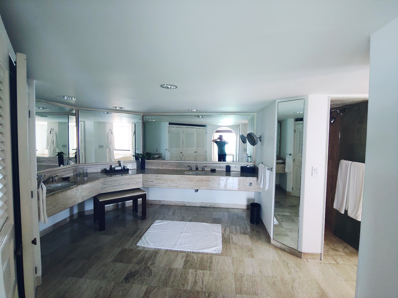 Spacious bathroom at Grand Fiesta Americana Coral Beach with dual vanities, large mirrors, soaking tub, and marble countertops.