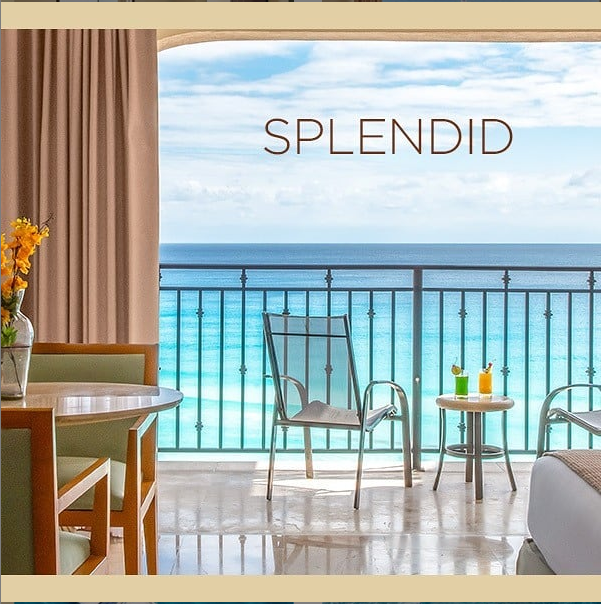 Grand Park Royal Cancun's dining room features curved wooden ceilings, lime-green accent walls, and tables set with white linens on a sandy floor.