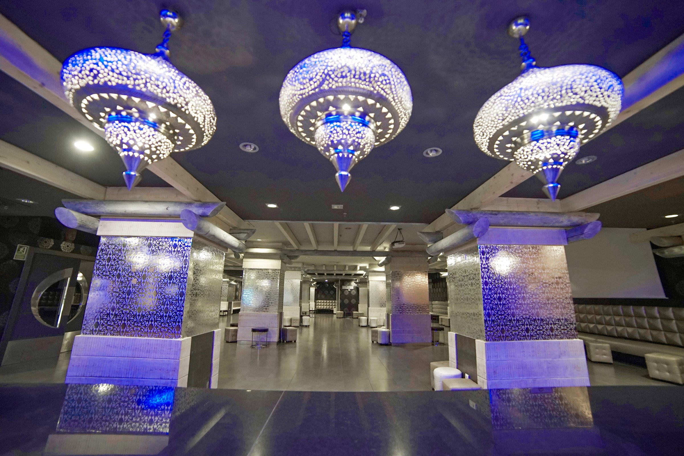 Ukelele lounge bar with silver mosaic decor