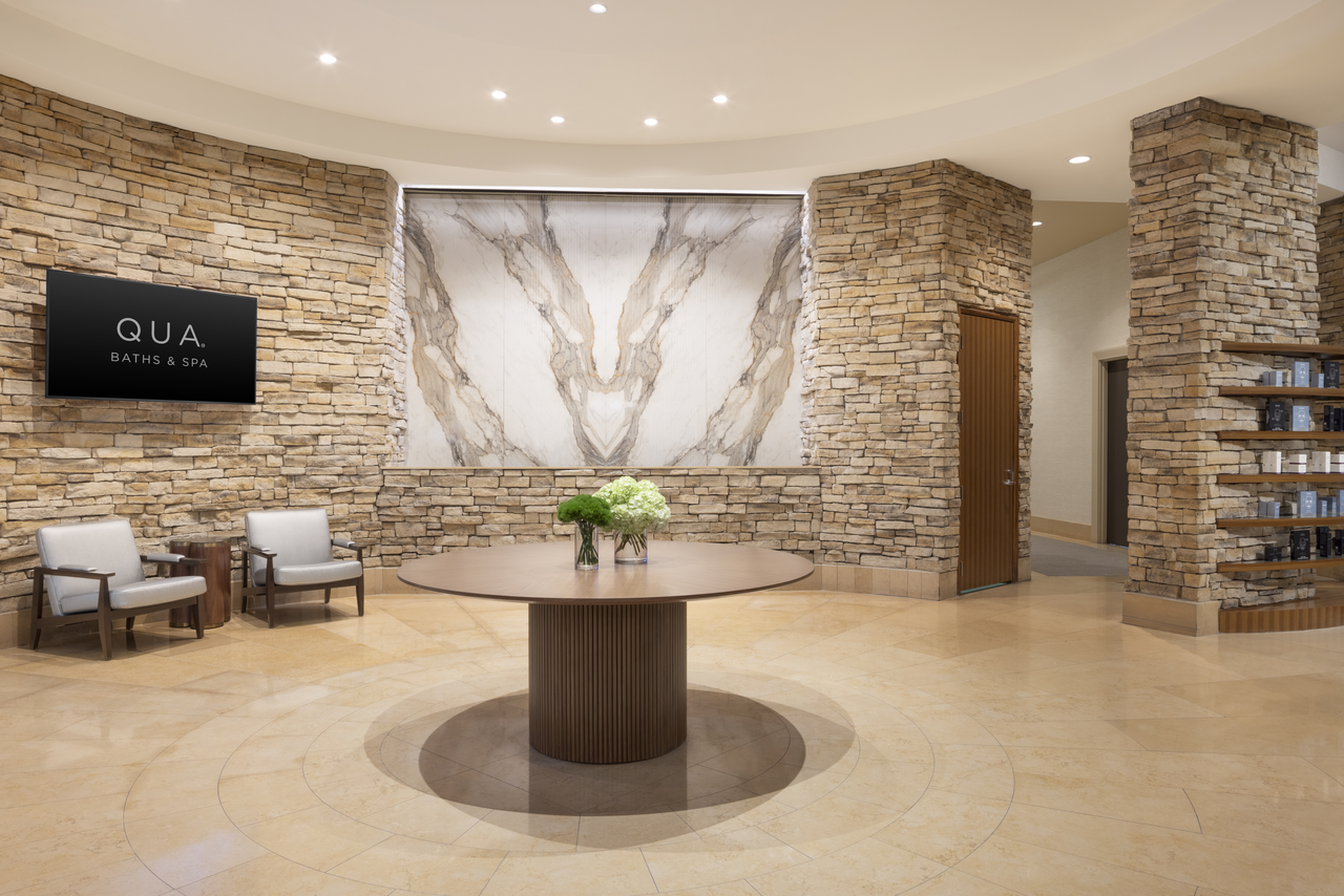 Bacchanal Buffet interior with light blue tiled counter displaying seafood and prepared foods under recessed lighting.