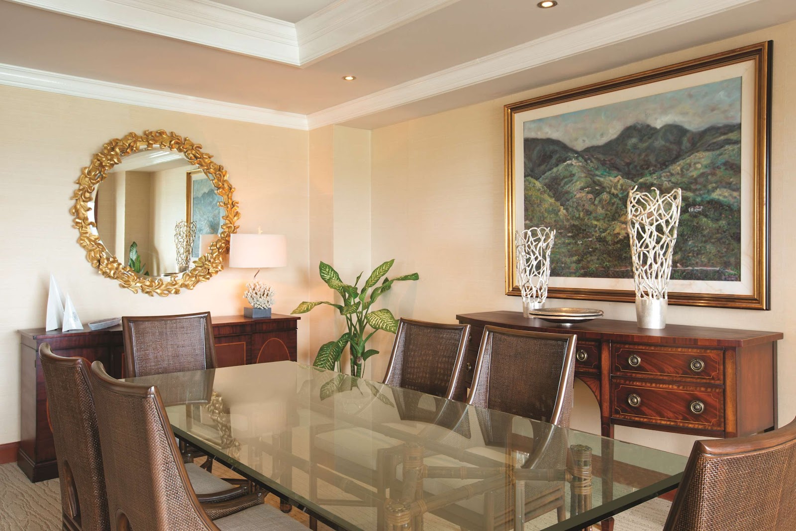 White balcony with two chairs and a small table with flowers overlooking the turquoise Caribbean Sea at Hyatt Ziva Rose Hall.