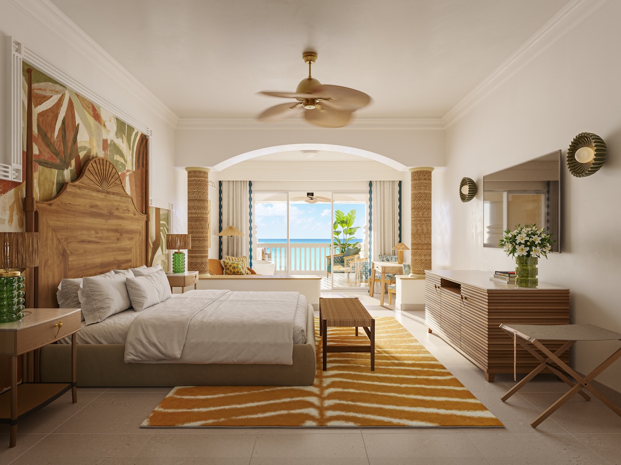 Spacious resort bedroom with wooden furnishings, ocean view from balcony, and tropical decor including plant artwork and woven accents.