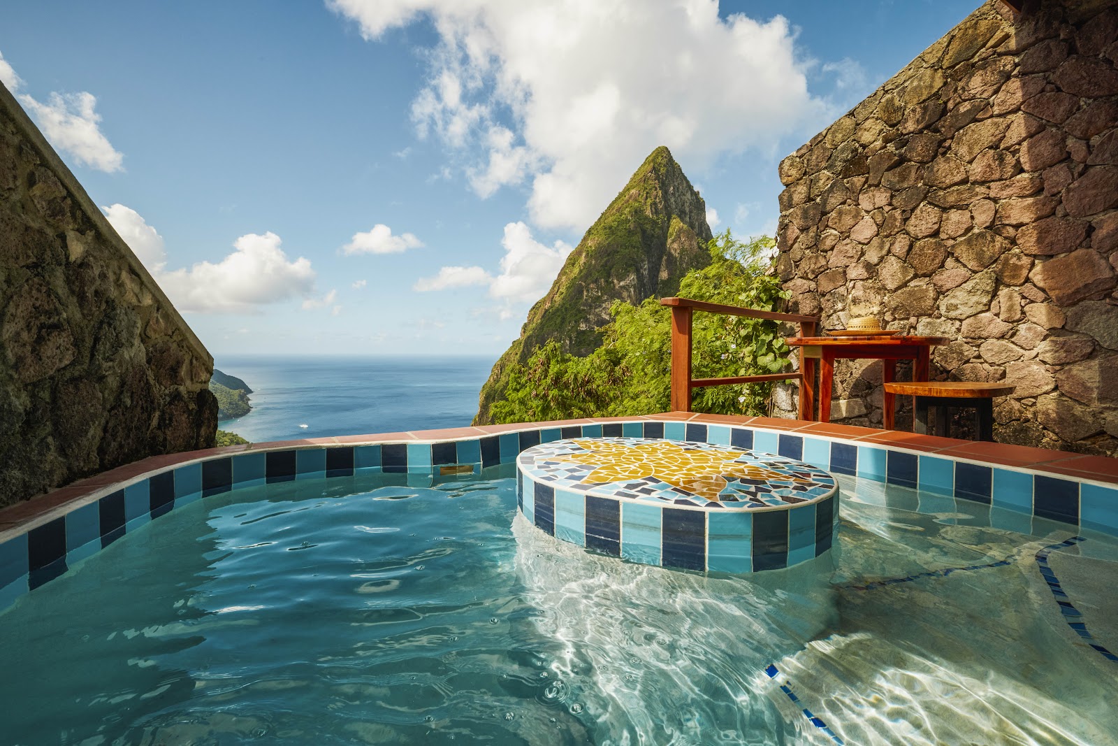 Infinity pool with tiled soaking tub overlooking dramatic sea cliffs and ocean at Ladera Resort.