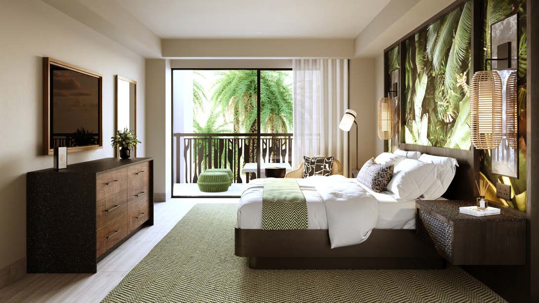 Resort bedroom with queen bed, green accent rug, tropical plant artwork above headboard, and balcony overlooking palm trees.