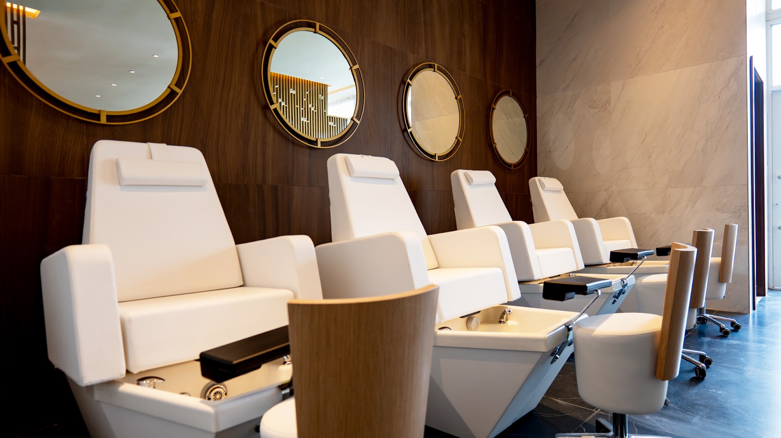 Modern lobby lounge with yellow sectional sofa, tropical plant décor, and round seating areas at Princess Grand Jamaica.