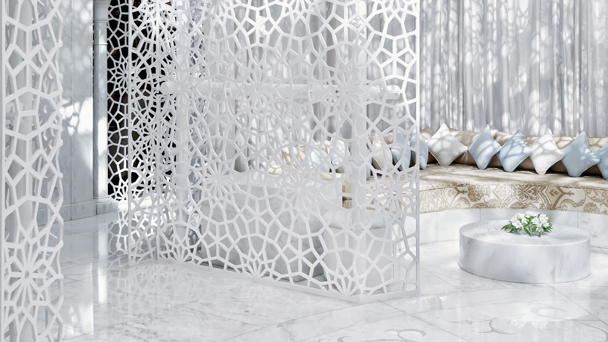 White marble floor and geometric lattice screens with cushioned seating and potted plants in a bright, minimalist spa pavilion at Royal Mansour Marrakech.