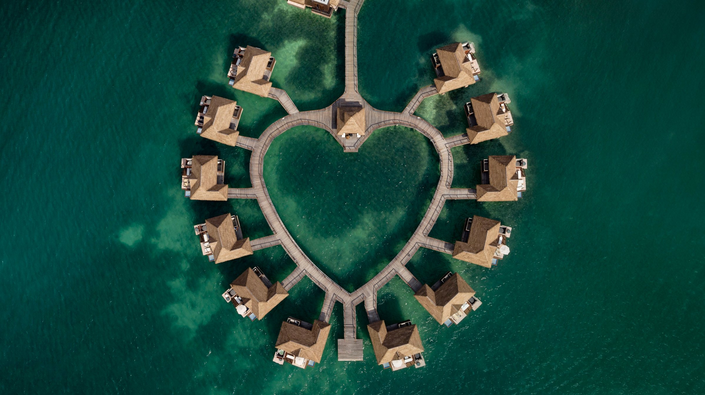 Bird's-eye view of the heart-shaped ring of over-water villas.