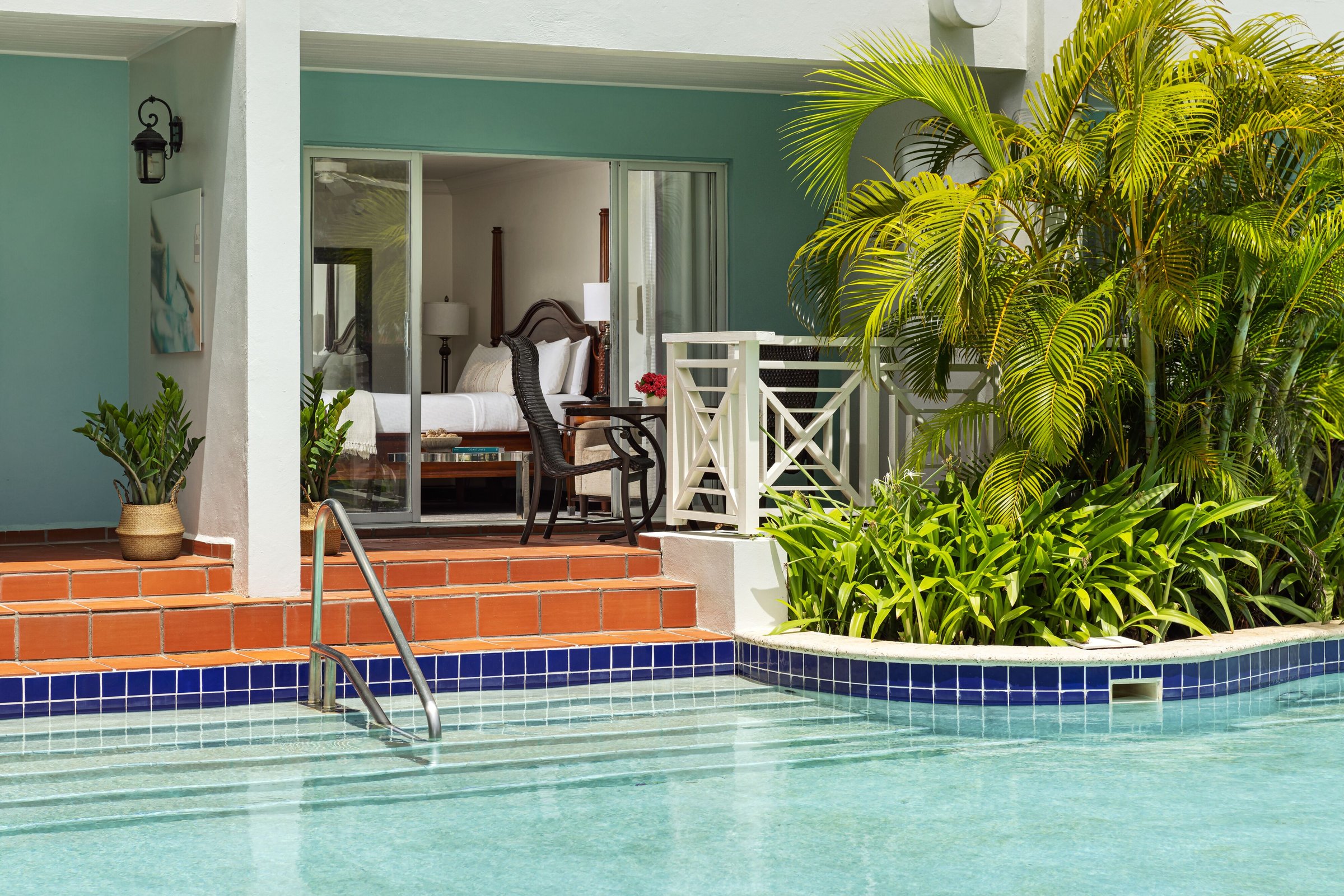 Swim-up suite terrace stepping straight into the pool from the bedroom.