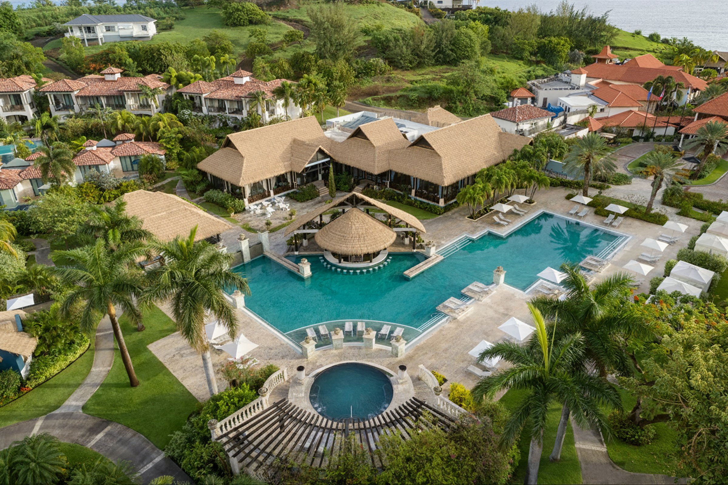 Aerial of the South Seas pool with a thatched swim-up bar and whirlpool.