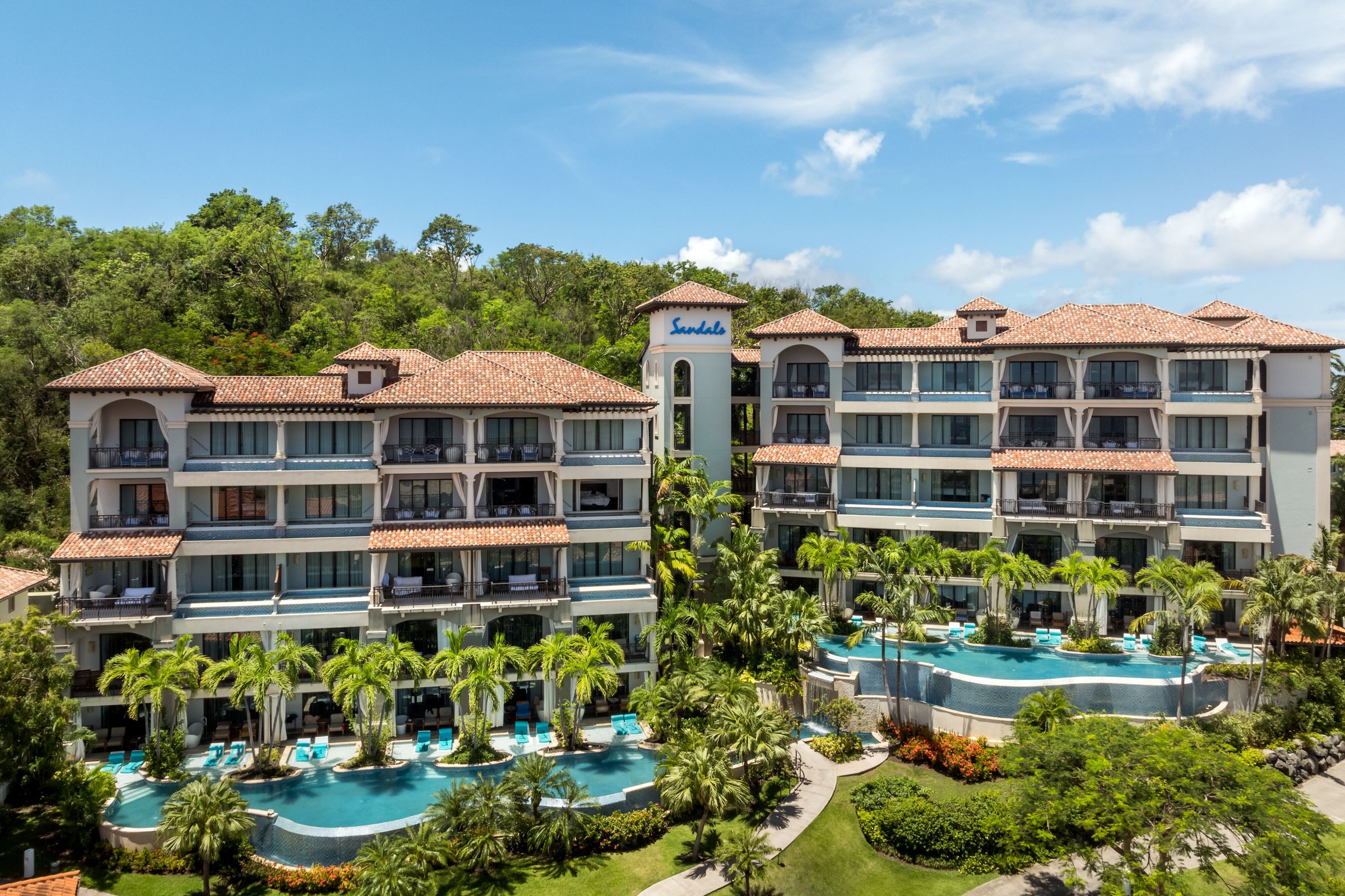 Italian Village suite blocks with tiered swim-up pools and gardens.