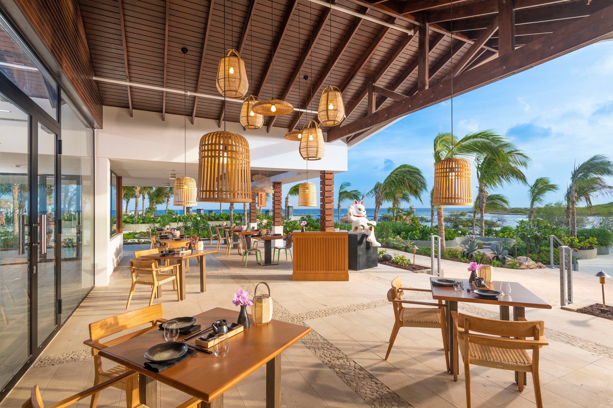 Gatsu Gatsu open-air dining under rattan pendants.