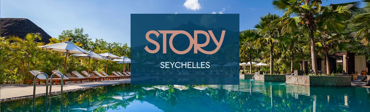 Story Seychelles resort pool with turquoise water, loungers, umbrellas, and palm trees under clear sky.