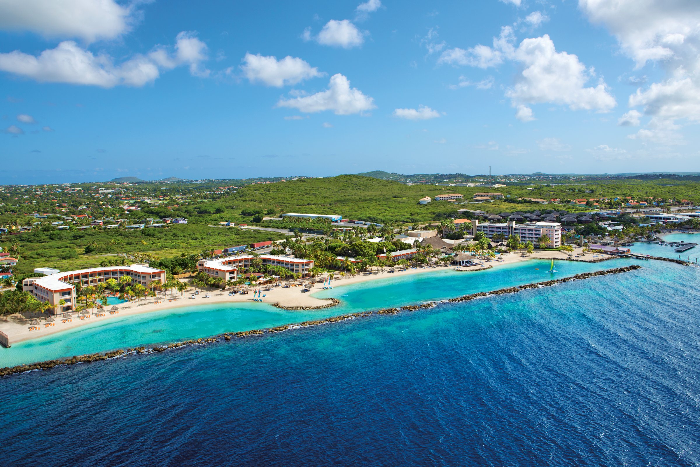 Wide aerial view of the resort coastline and two lagoons