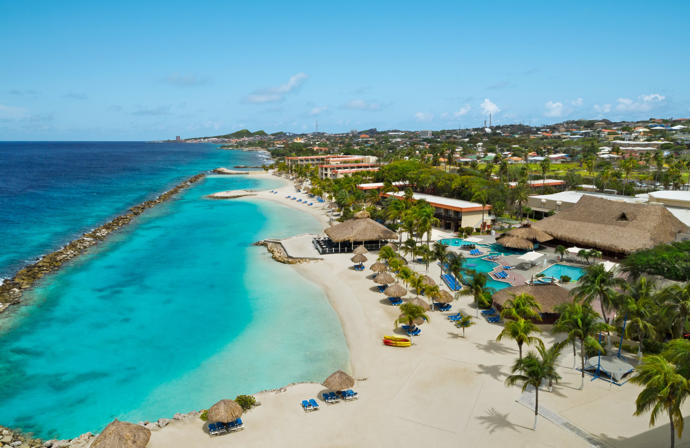 Aerial view of the resort, beach and breakwater lagoon