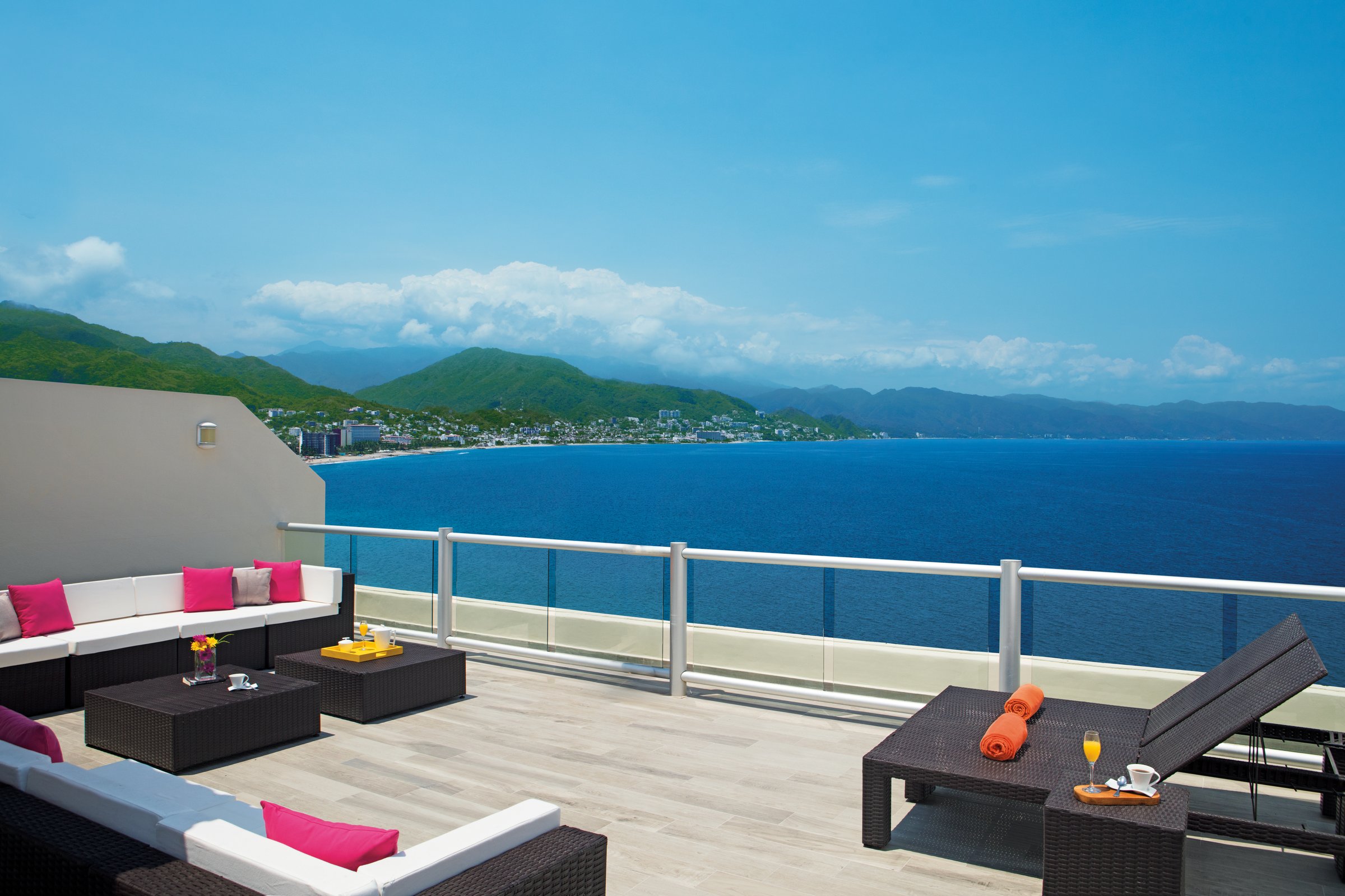 Suite terrace with lounge seating and bay view