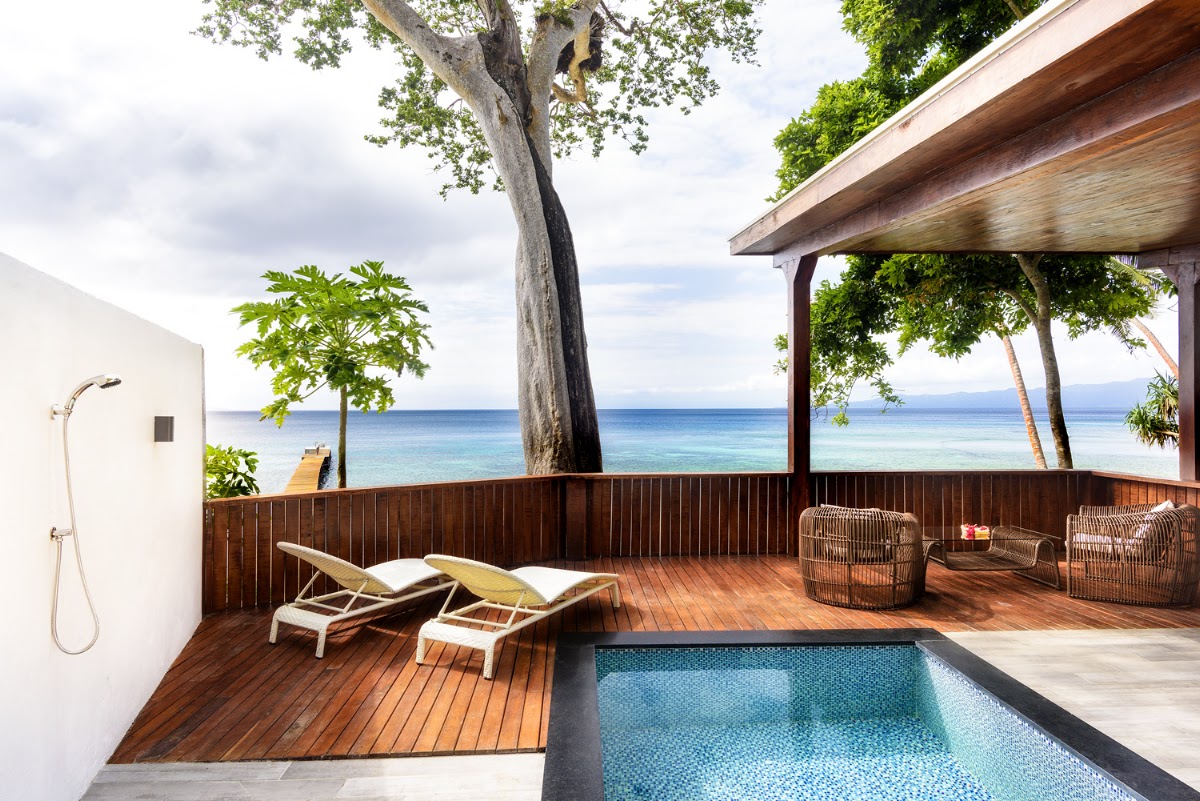 Private villa deck with plunge pool, lounge chairs, and ocean view at The Remote Resort Fiji Islands.